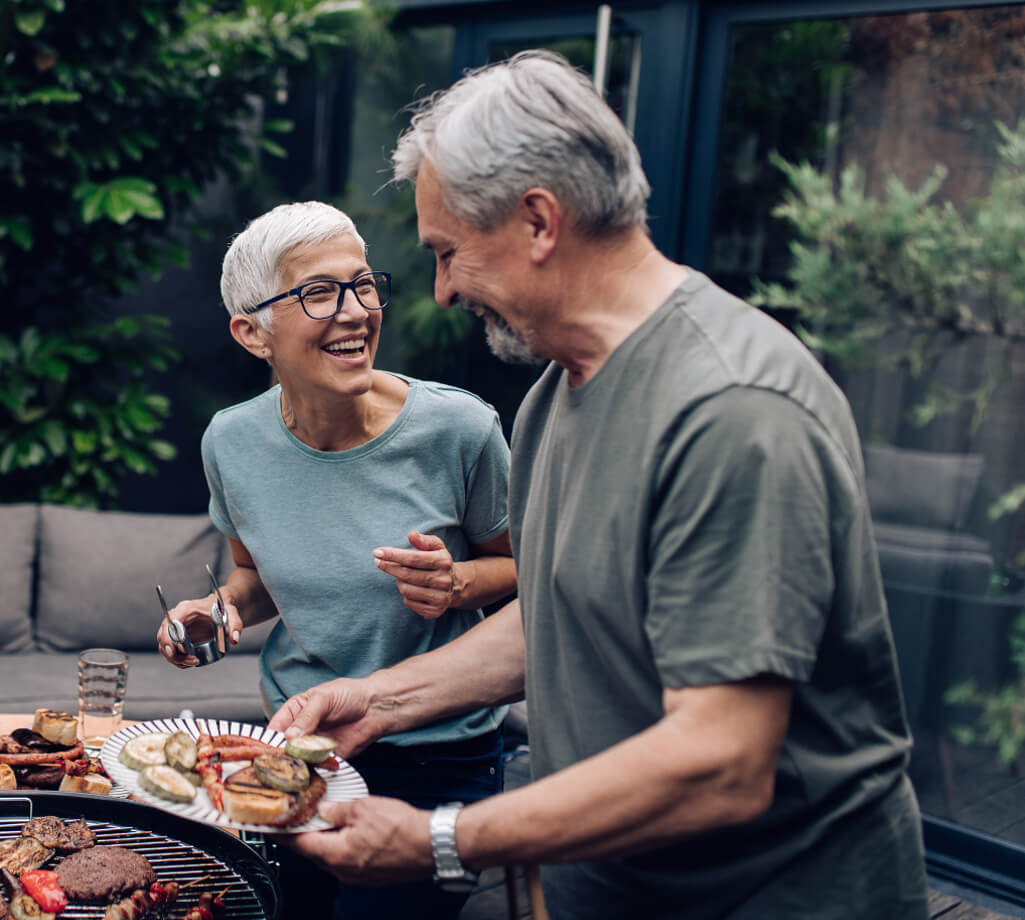 Older couple grilling - Implant Dentistry in Thorncreek, CO