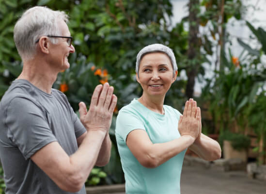 Older couple doing yoga - Mercury free fillings in Thorncreek, CO