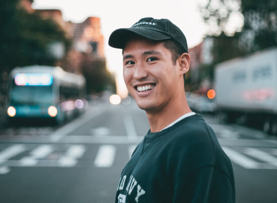 Man smiling in a crosswalk - Teeth whitening in Thorncreek, CO